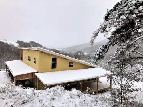 Strawbale Lodge new porch winter scene